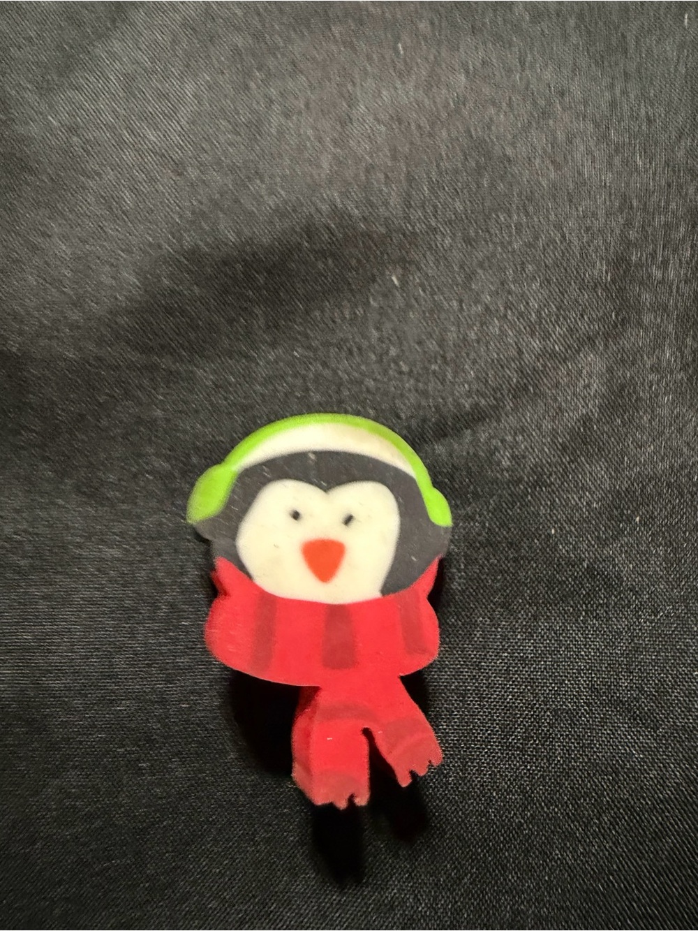 Source Unknown Penguin Eraser Pin with Green Headphones and Red Scarf